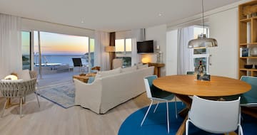 a living room with a table and chairs