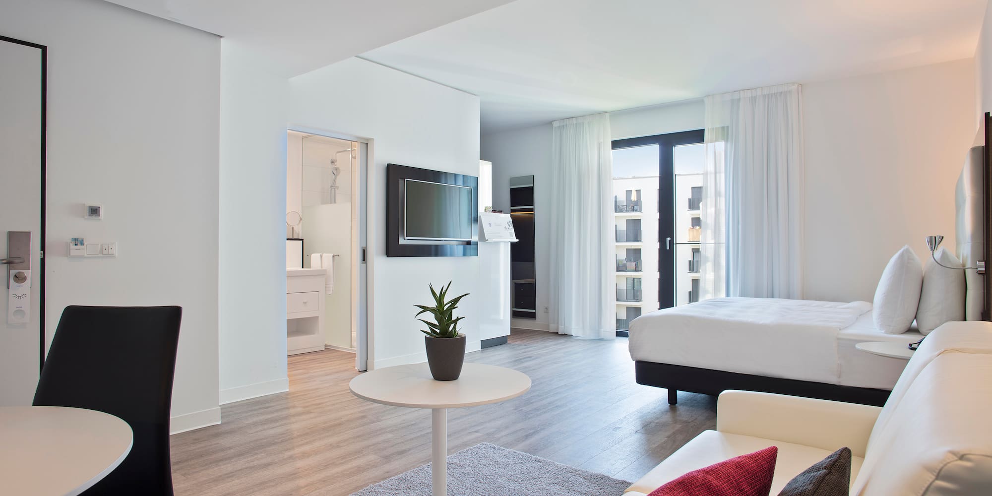 a room with a bed and a tv