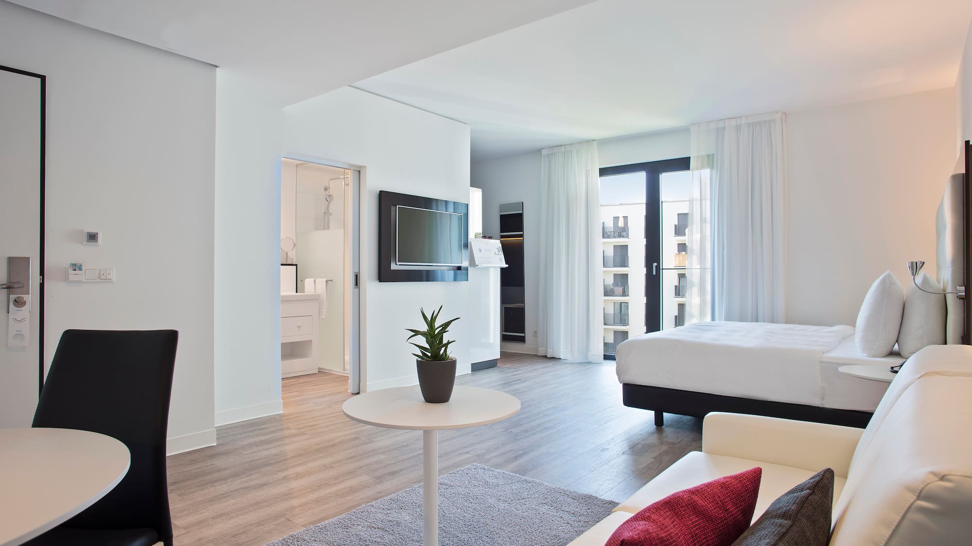 a room with a bed and a tv