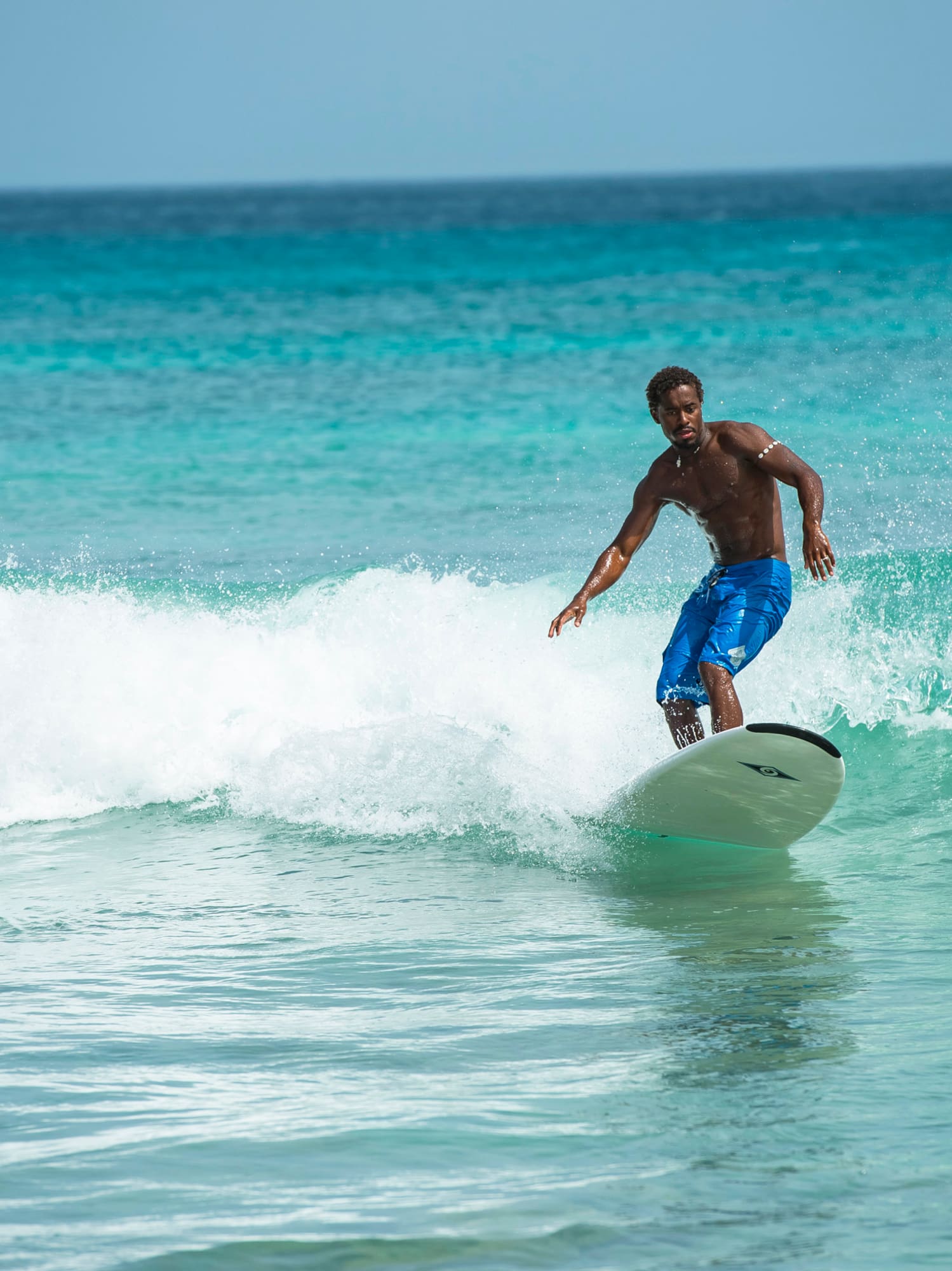a man surfing on a wave