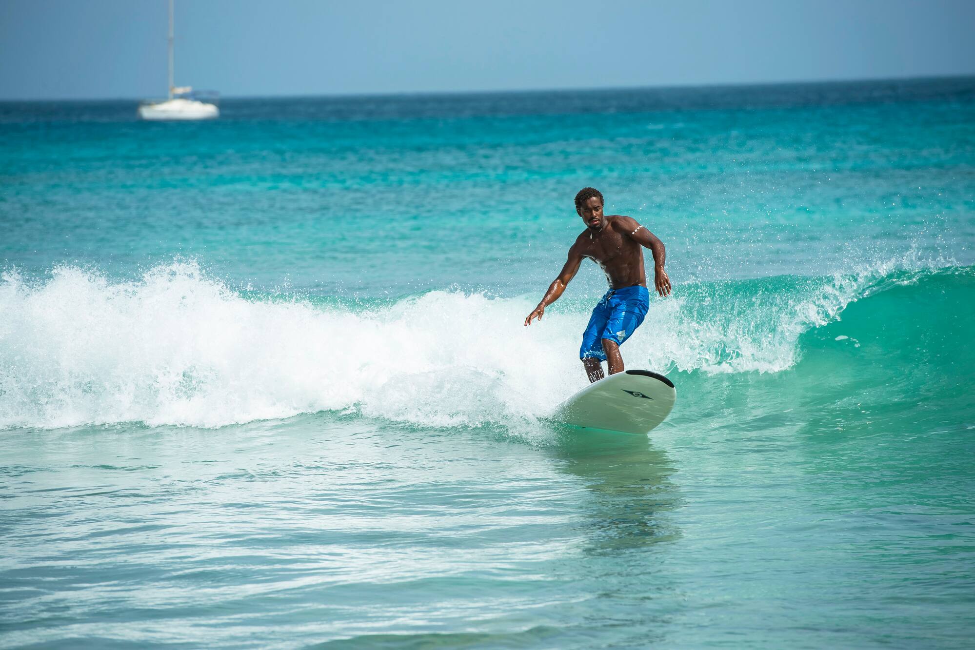 a man surfing on a wave