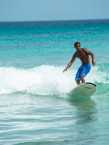 a man surfing on a wave