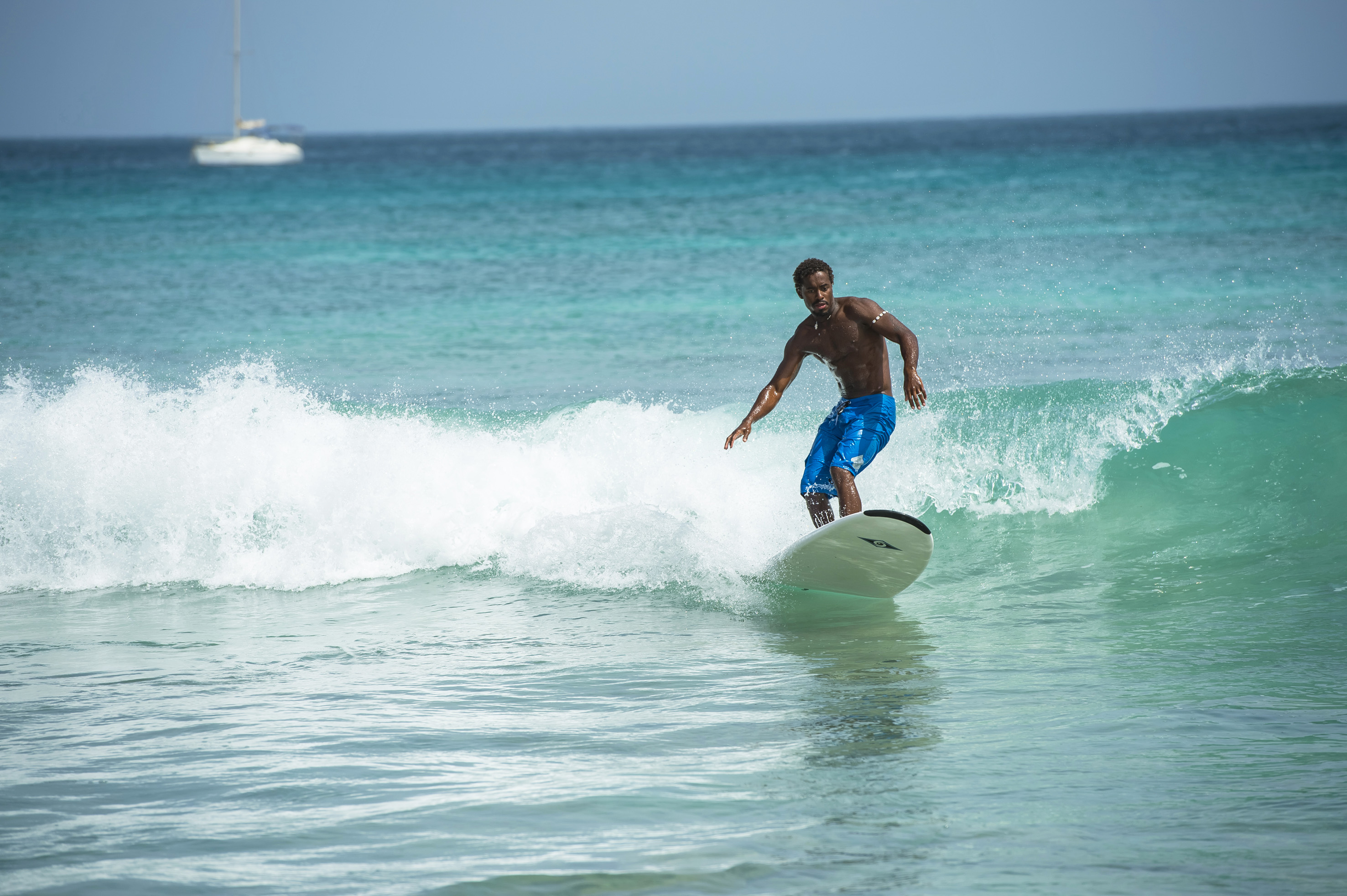 a man surfing on a wave