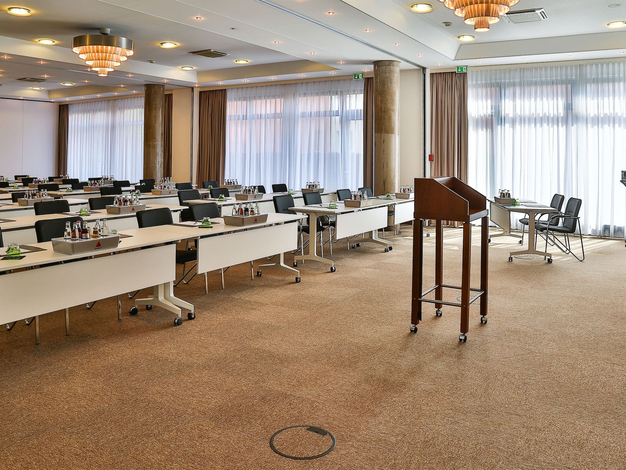 a room with many tables and chairs