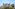 a castle with trees around it