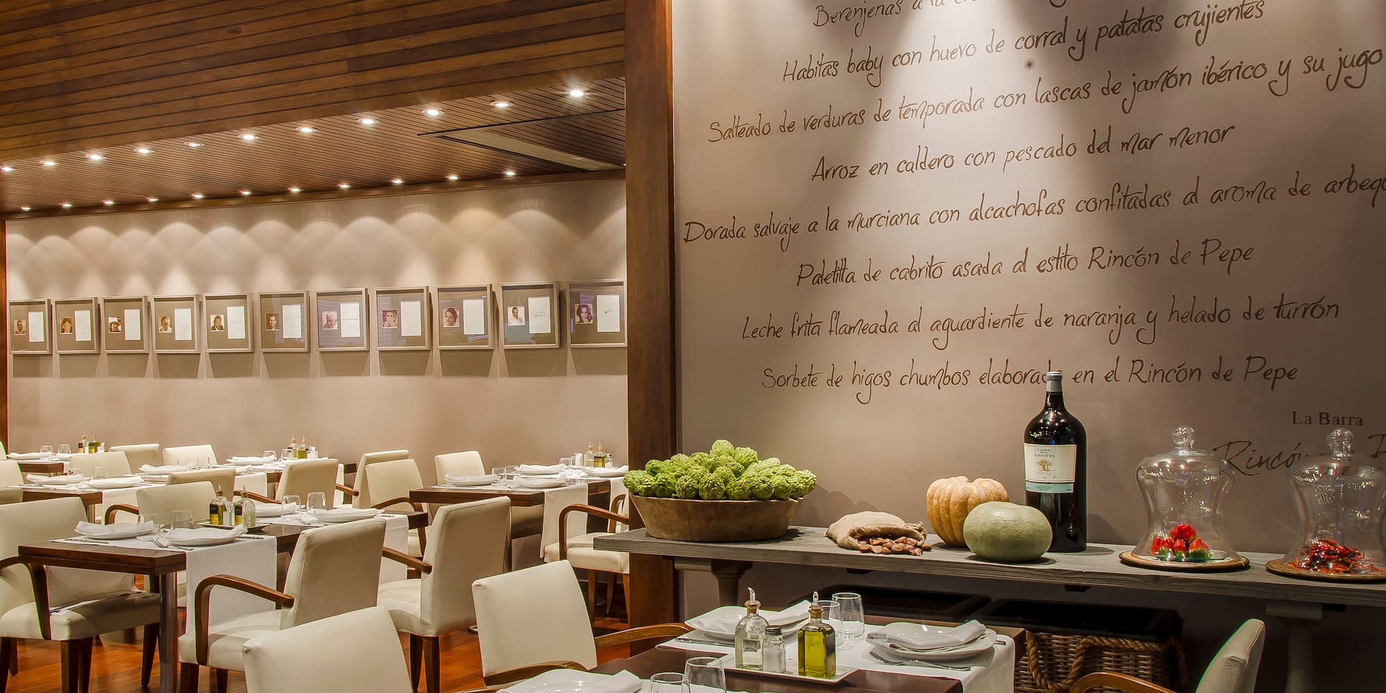 a restaurant with white chairs and tables