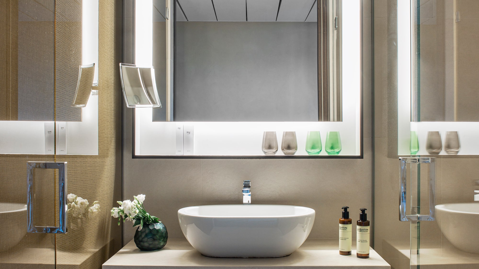 a bathroom with a mirror and sink