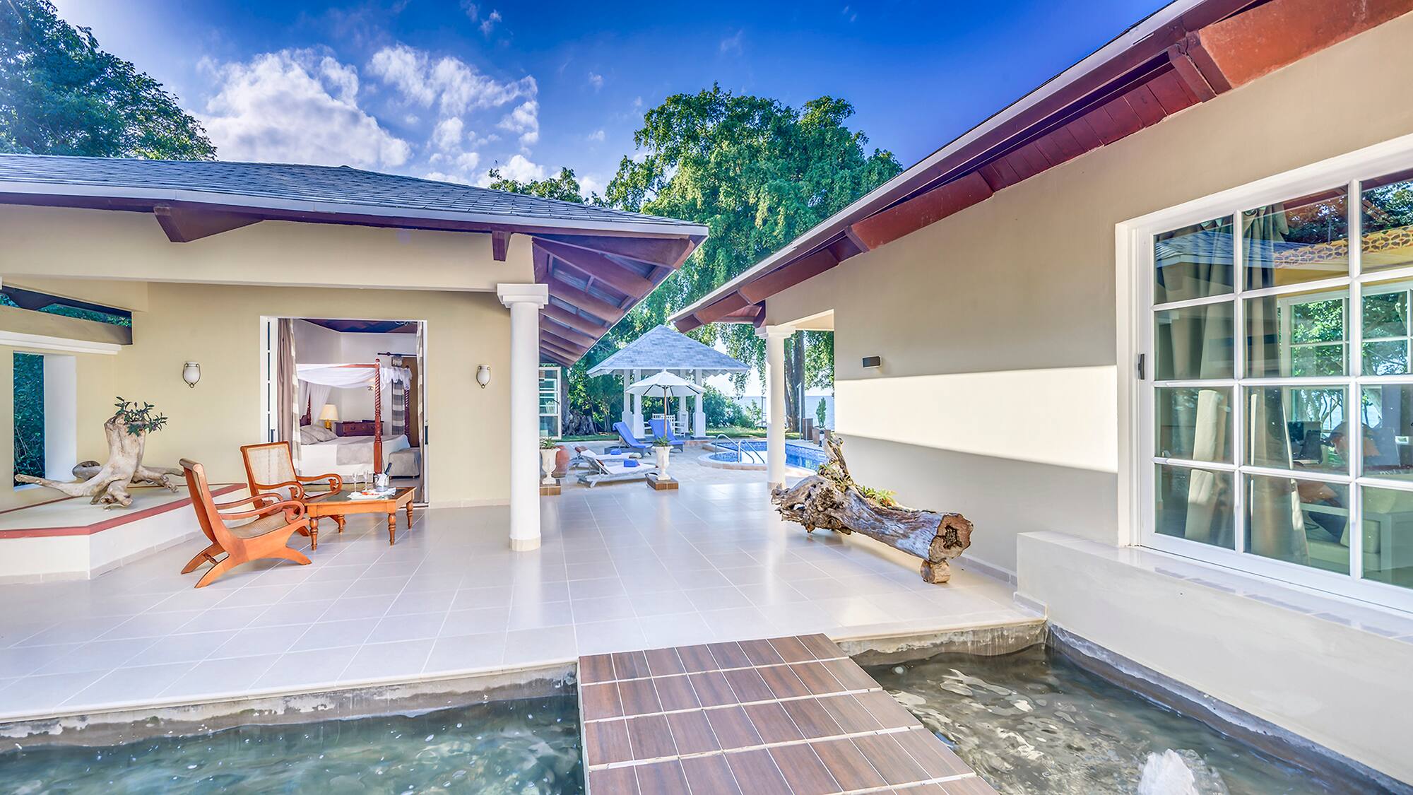 a house with a pool and a bed
