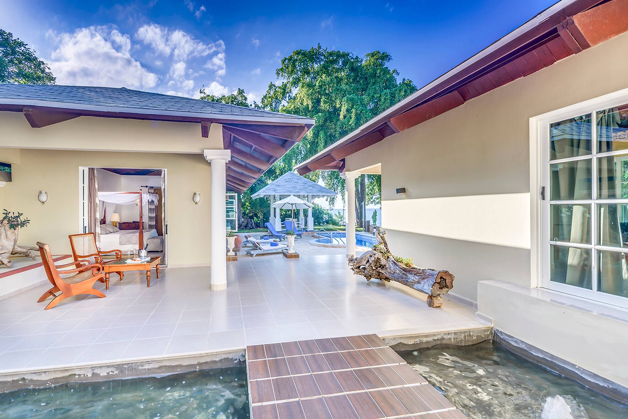 a house with a pool and a bed