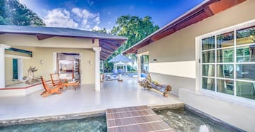 a house with a pool and a bed