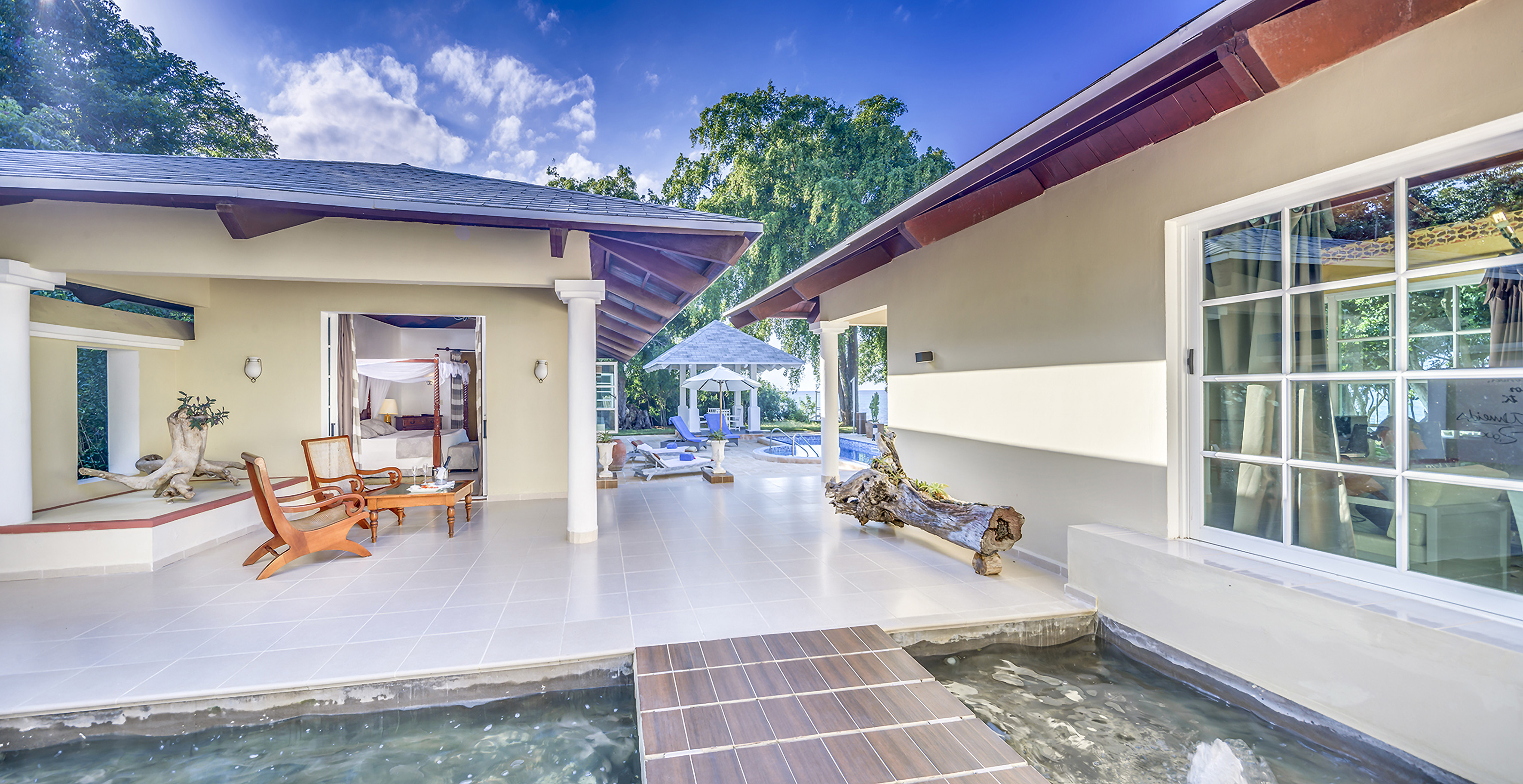 a house with a pool and a bed