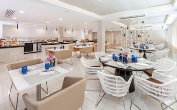 a restaurant with tables and chairs