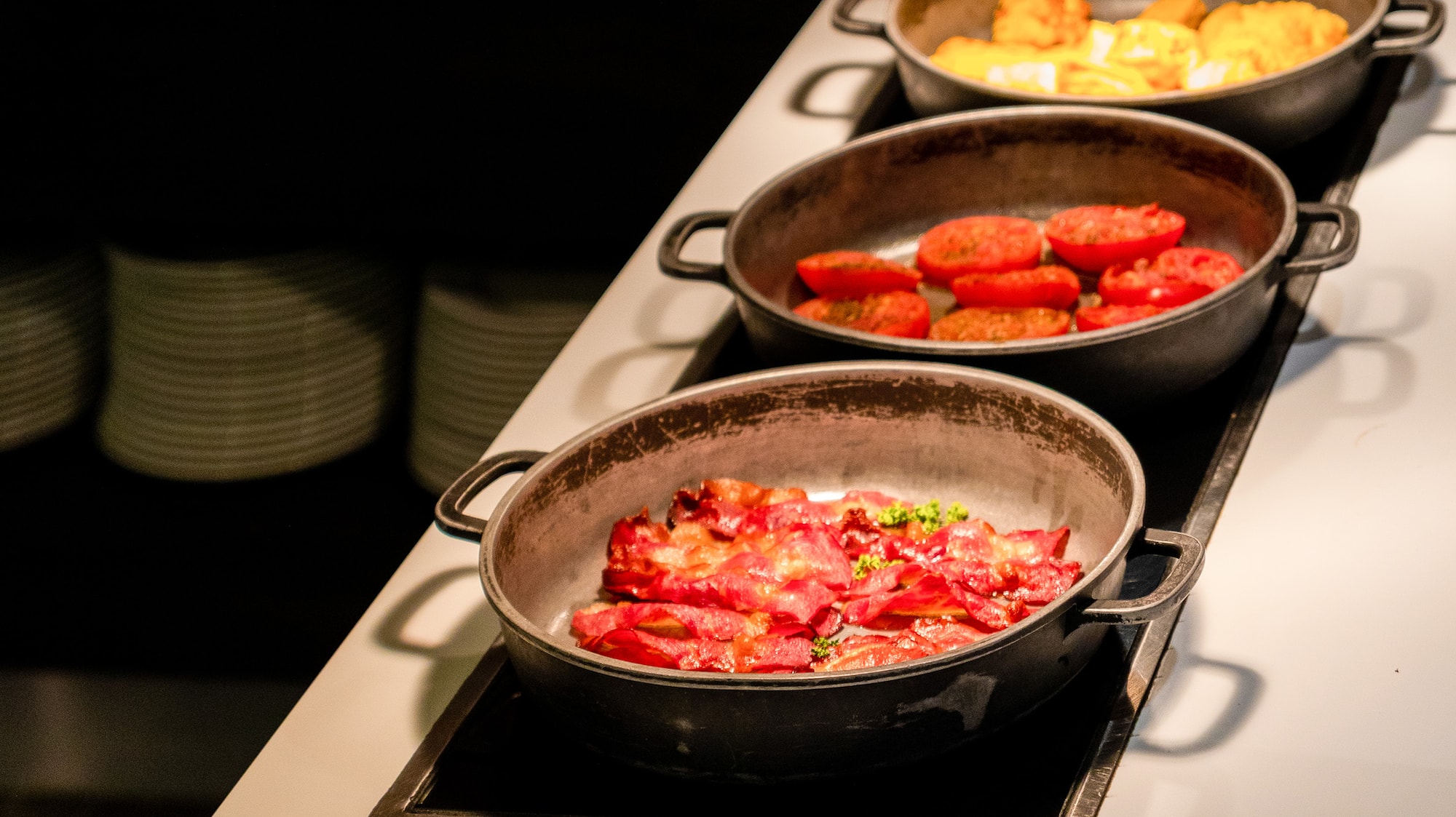 a group of pans with food in them