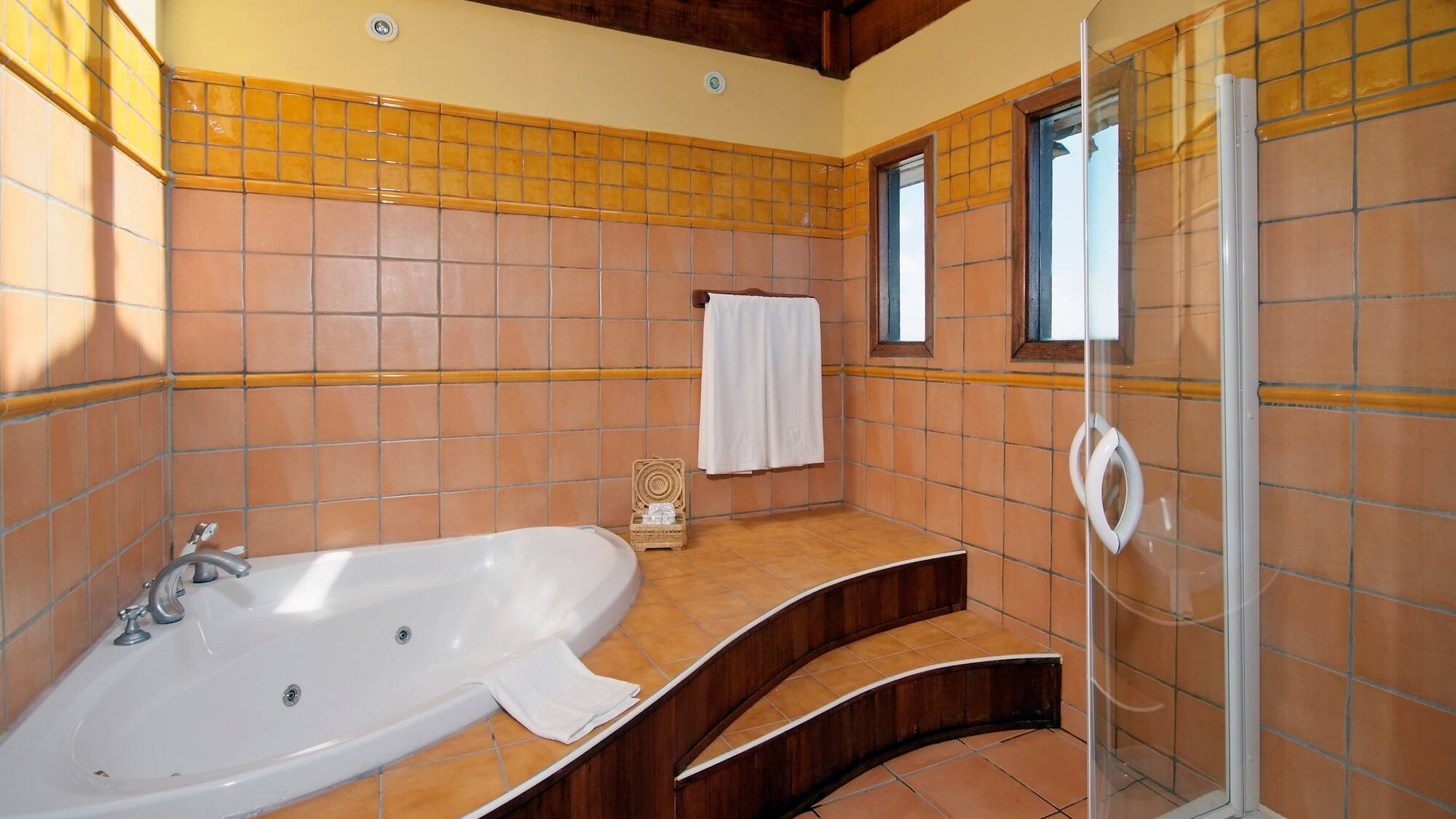 a bathroom with a bathtub and shower