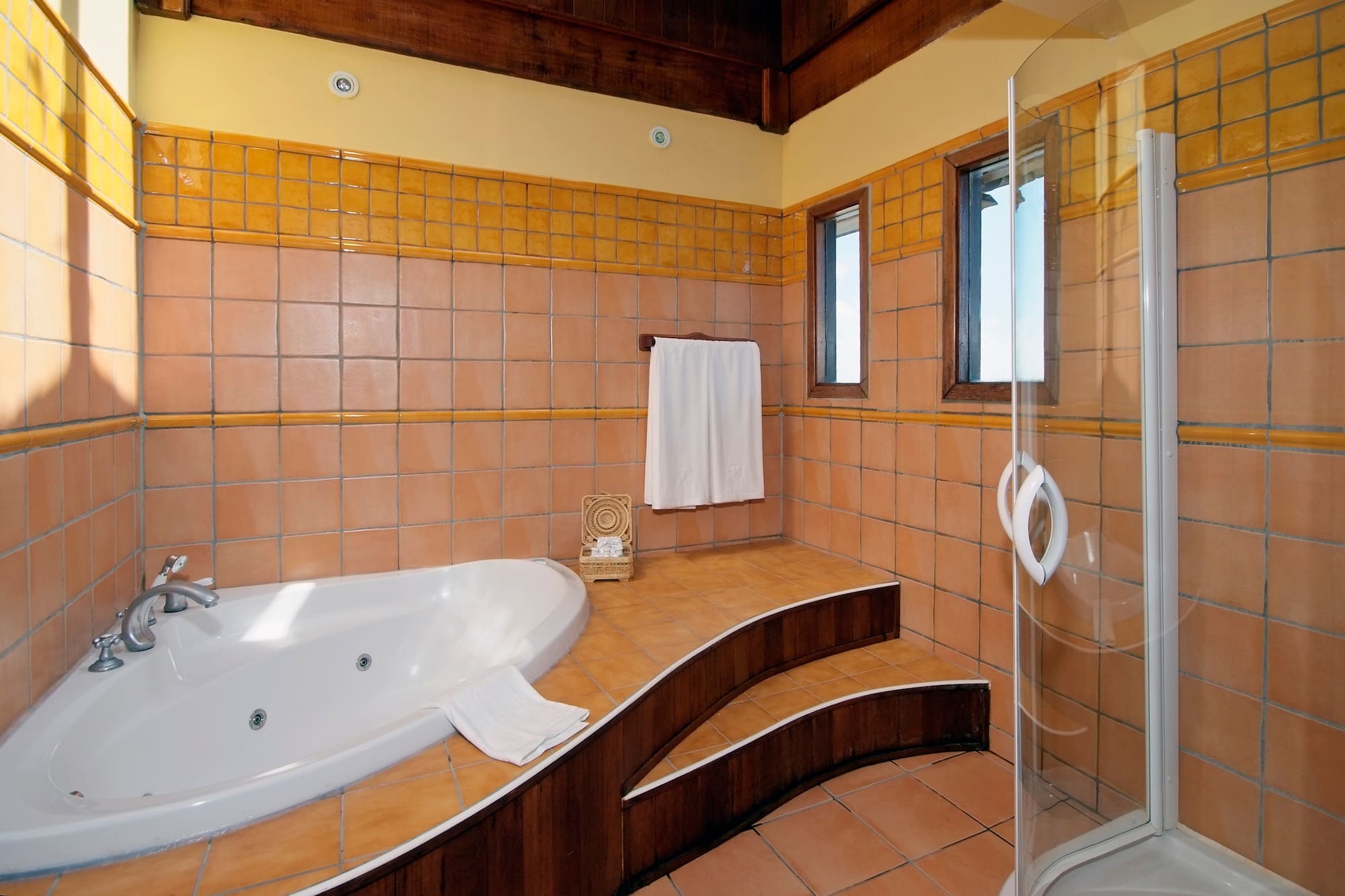 a bathroom with a bathtub and shower