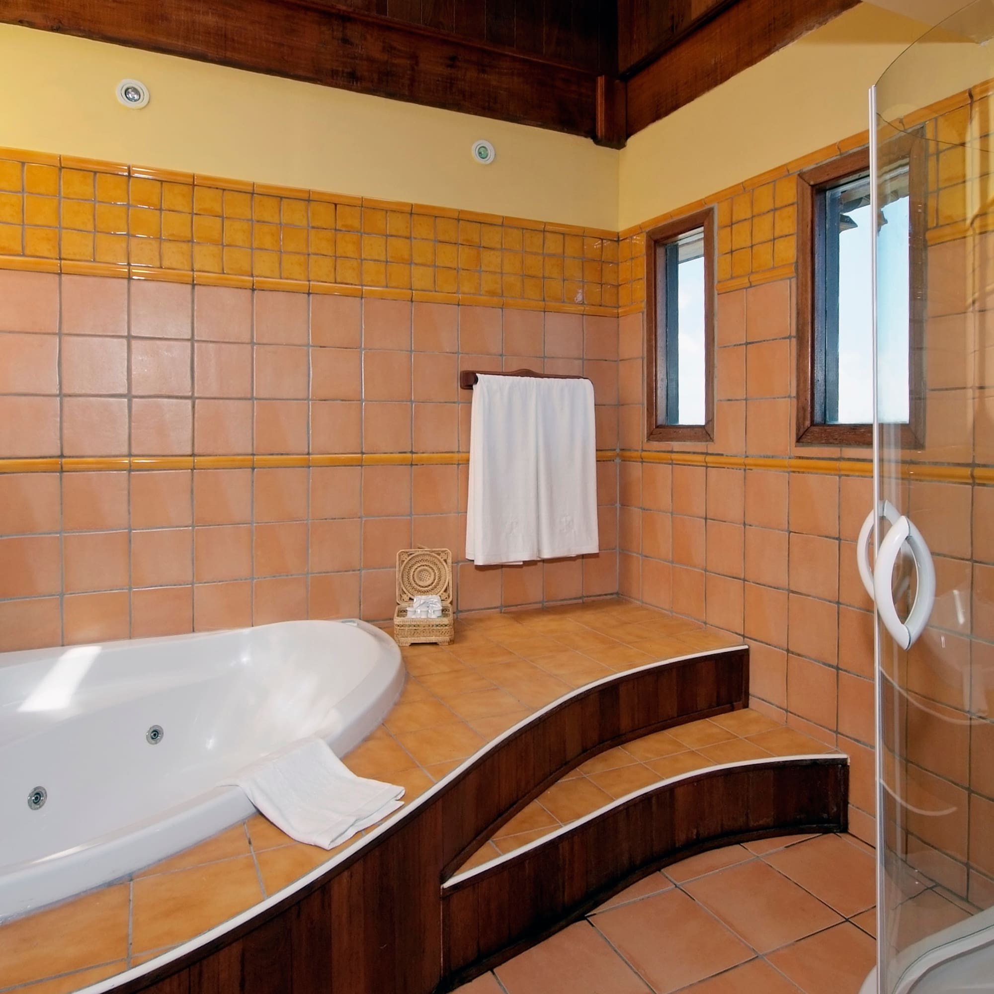 a bathroom with a bathtub and shower