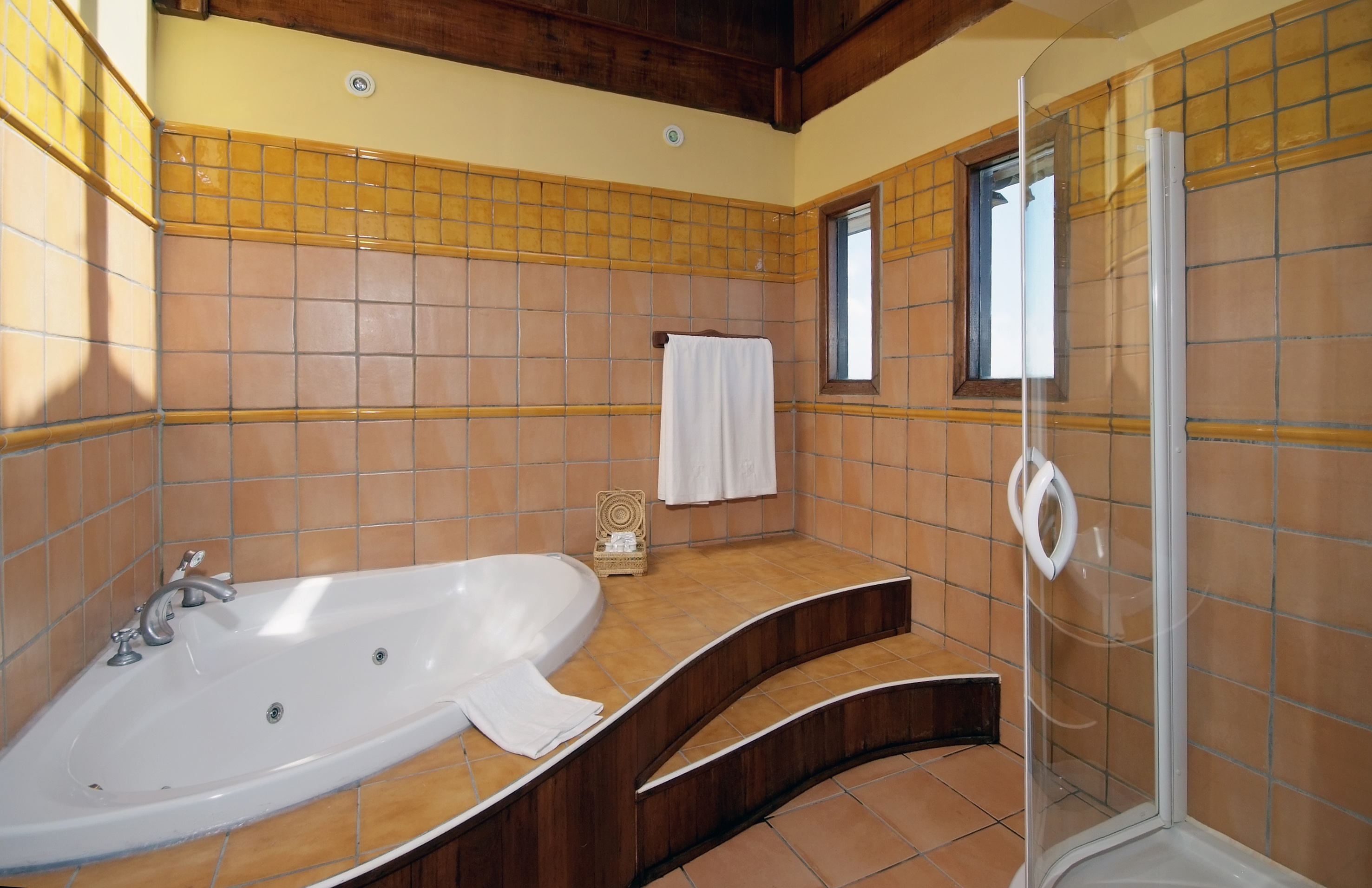 a bathroom with a bathtub and shower