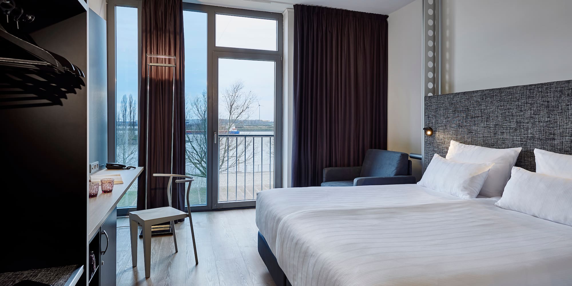 a room with a bed and a desk