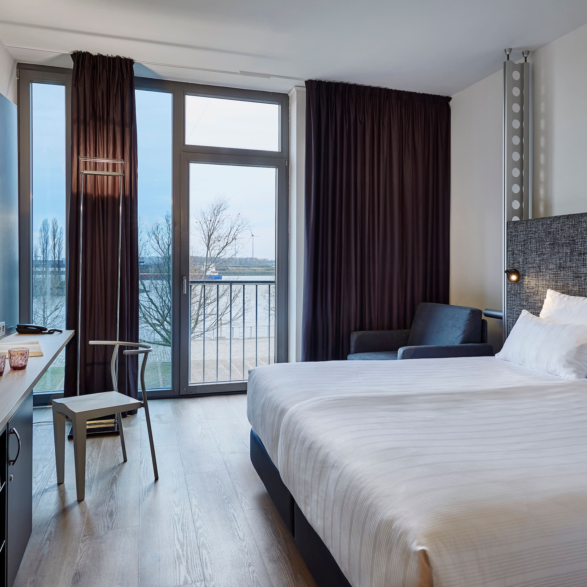 a room with a bed and a desk