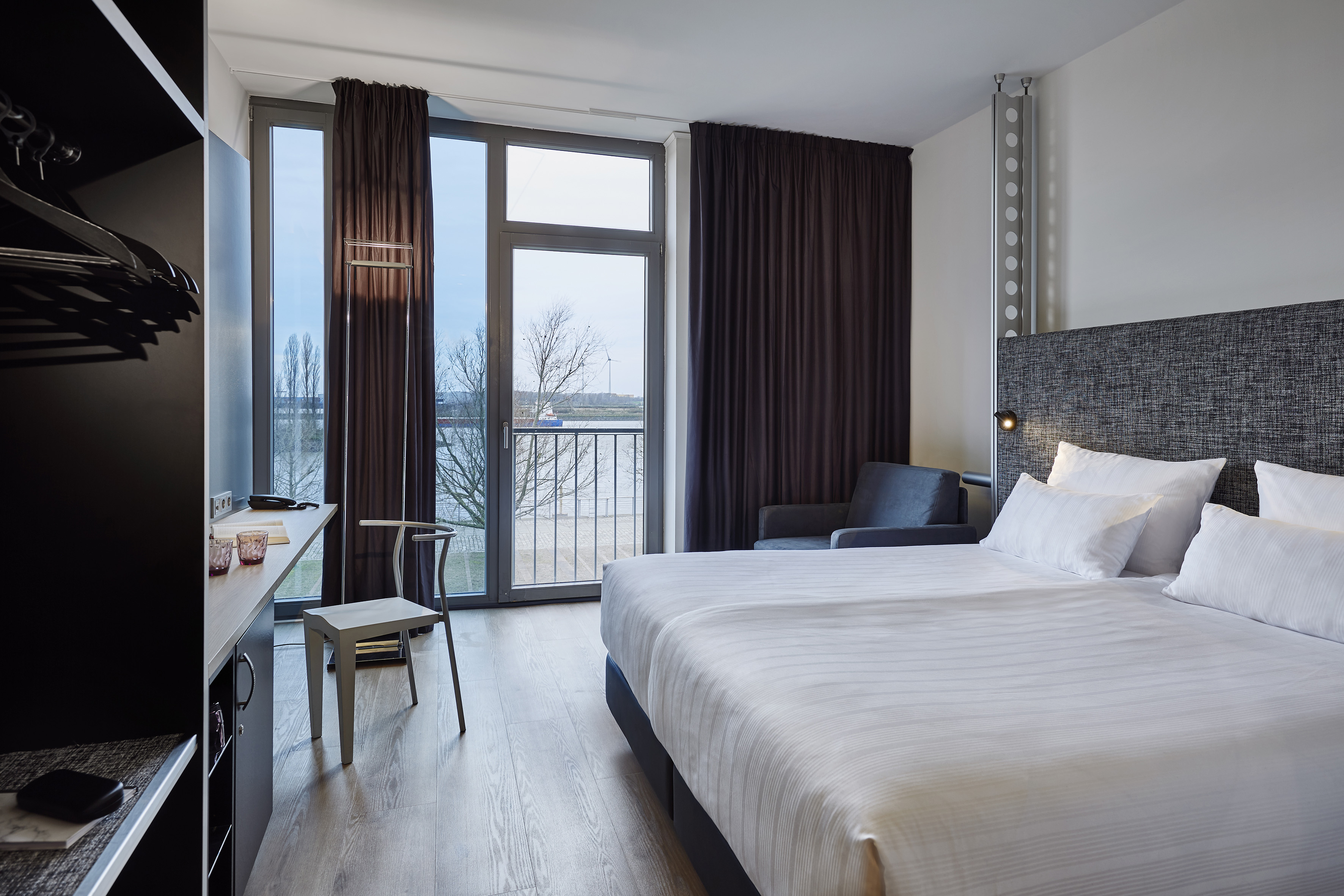 a room with a bed and a desk