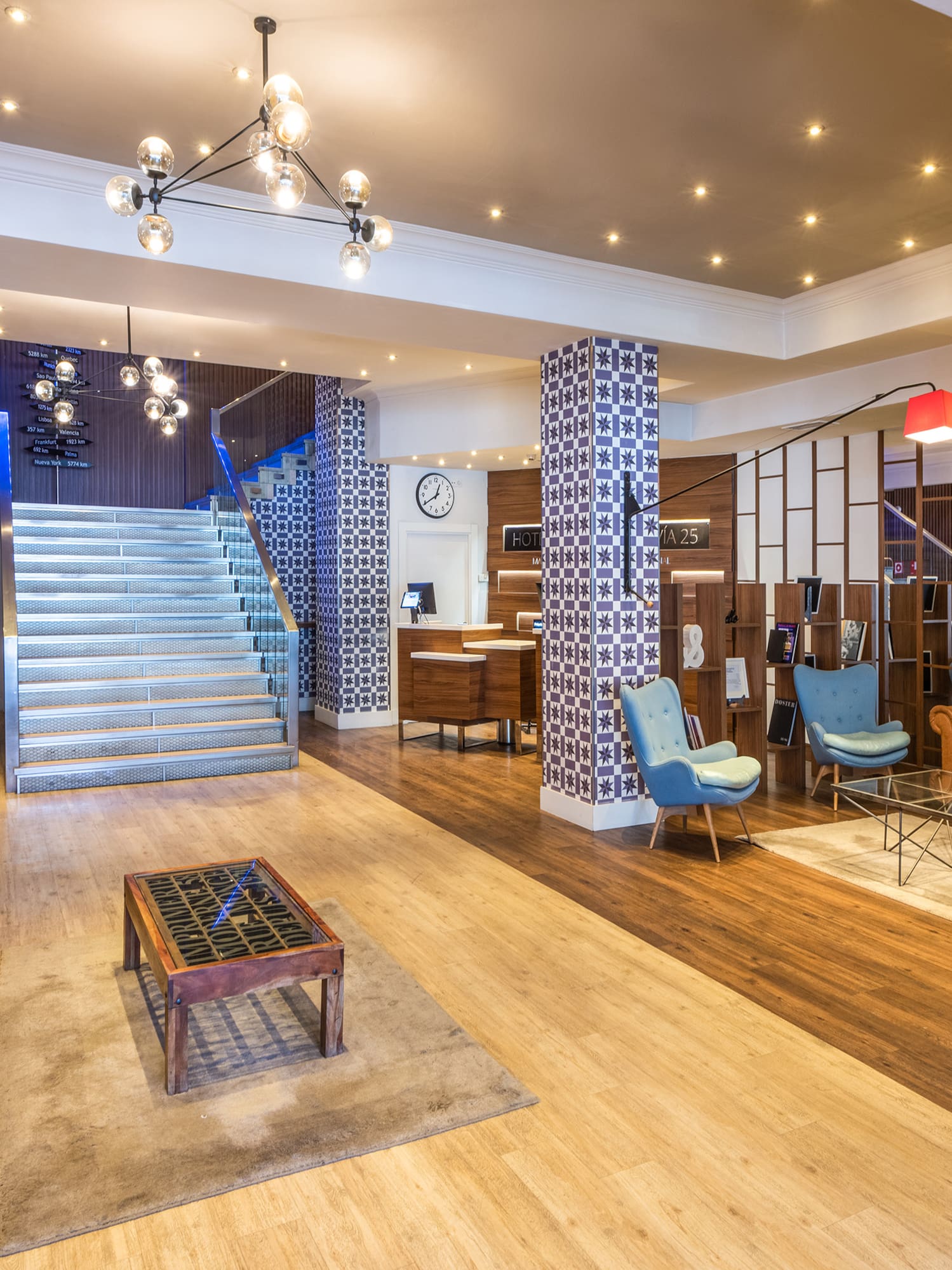 a room with a staircase and couches