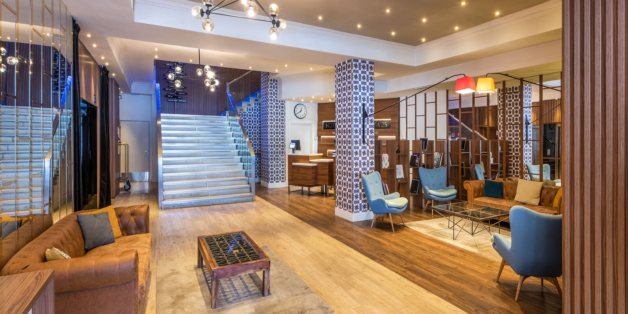 a room with a staircase and couches