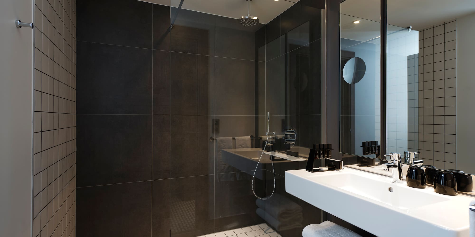 a bathroom with a shower and sink