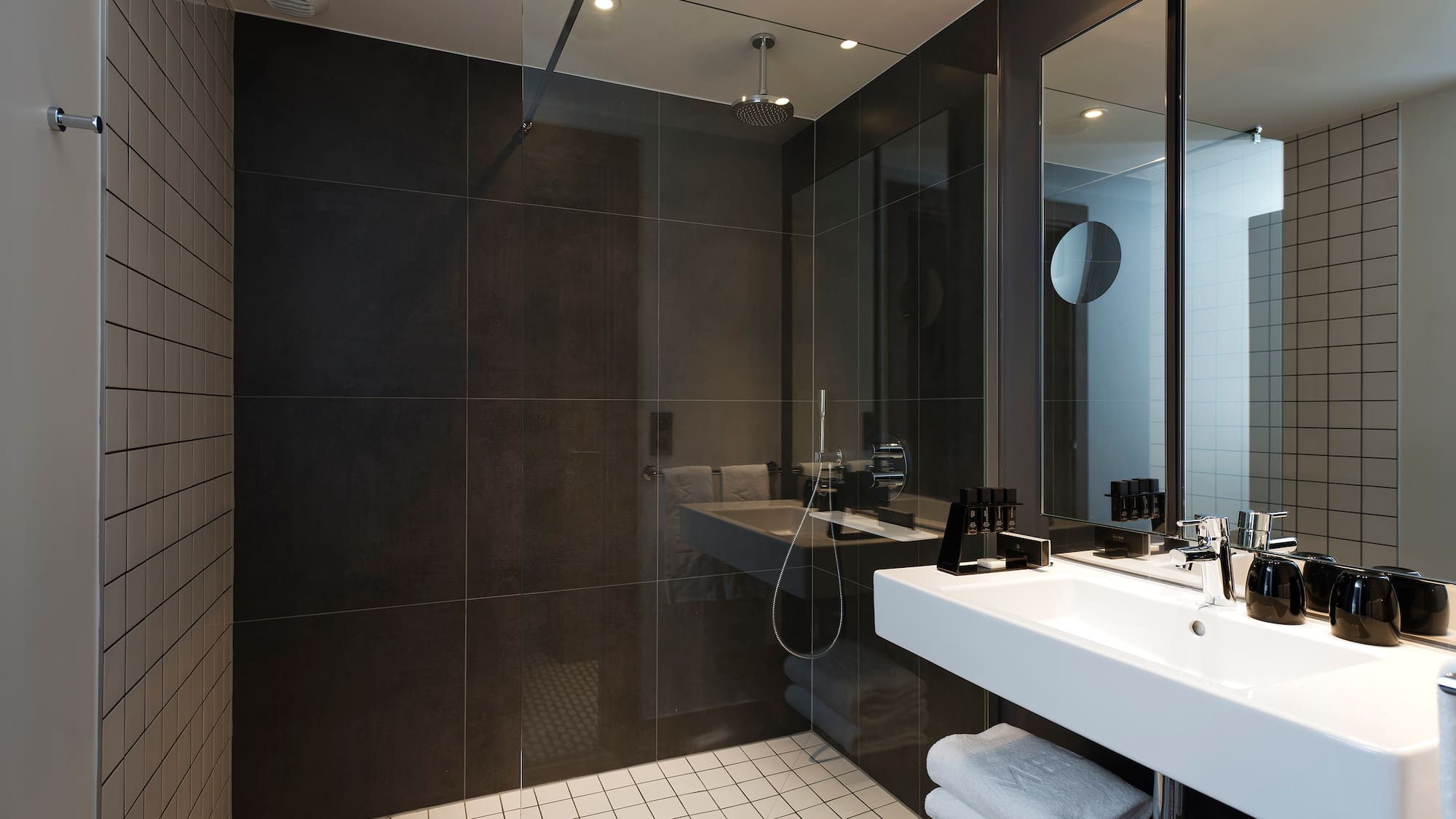 a bathroom with a shower and sink