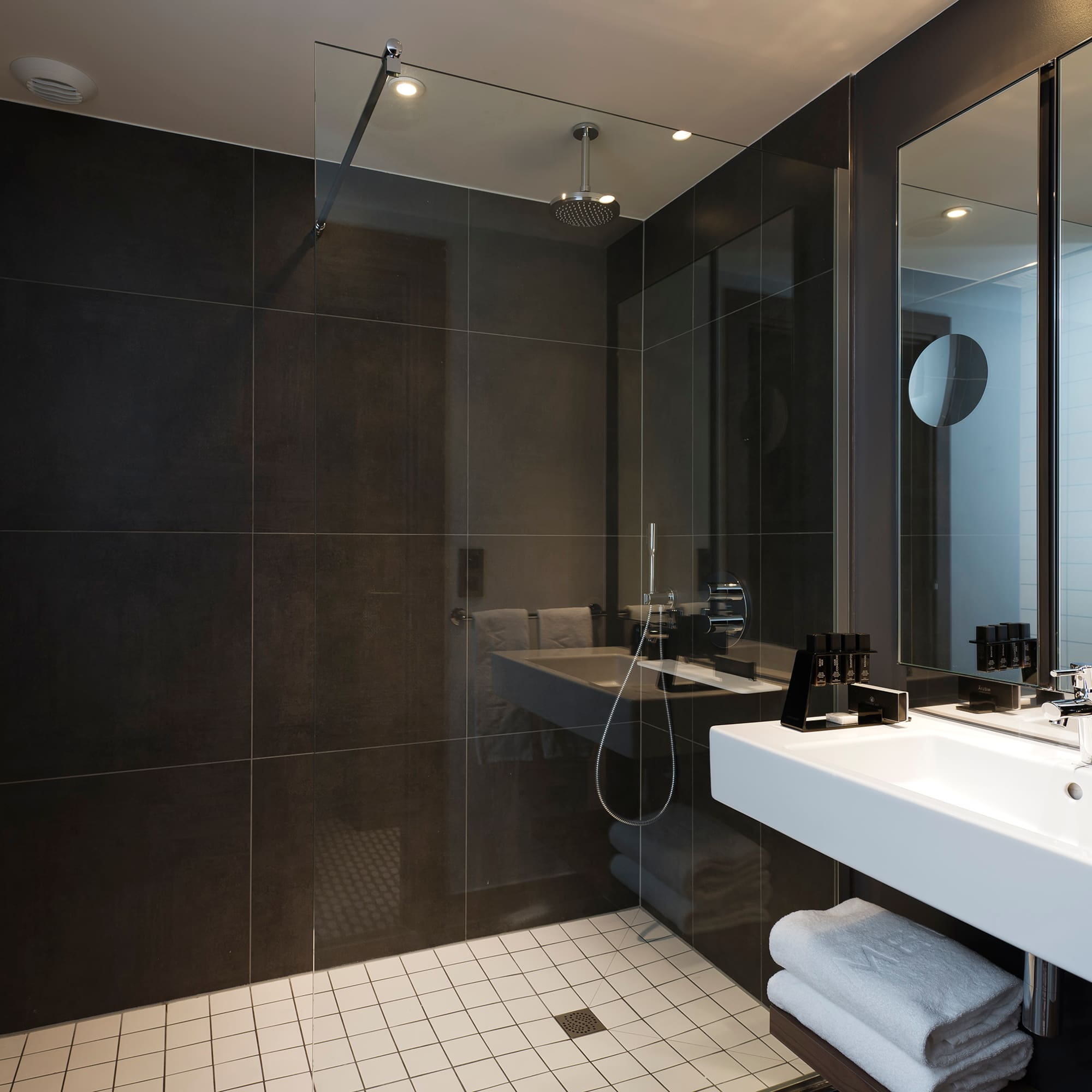 a bathroom with a shower and sink