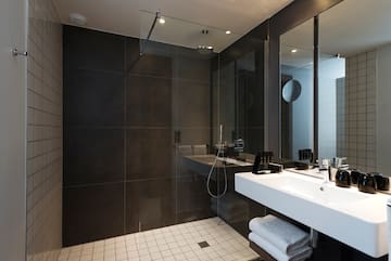 a bathroom with a shower and sink