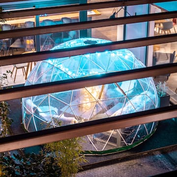 a glass dome with lights inside