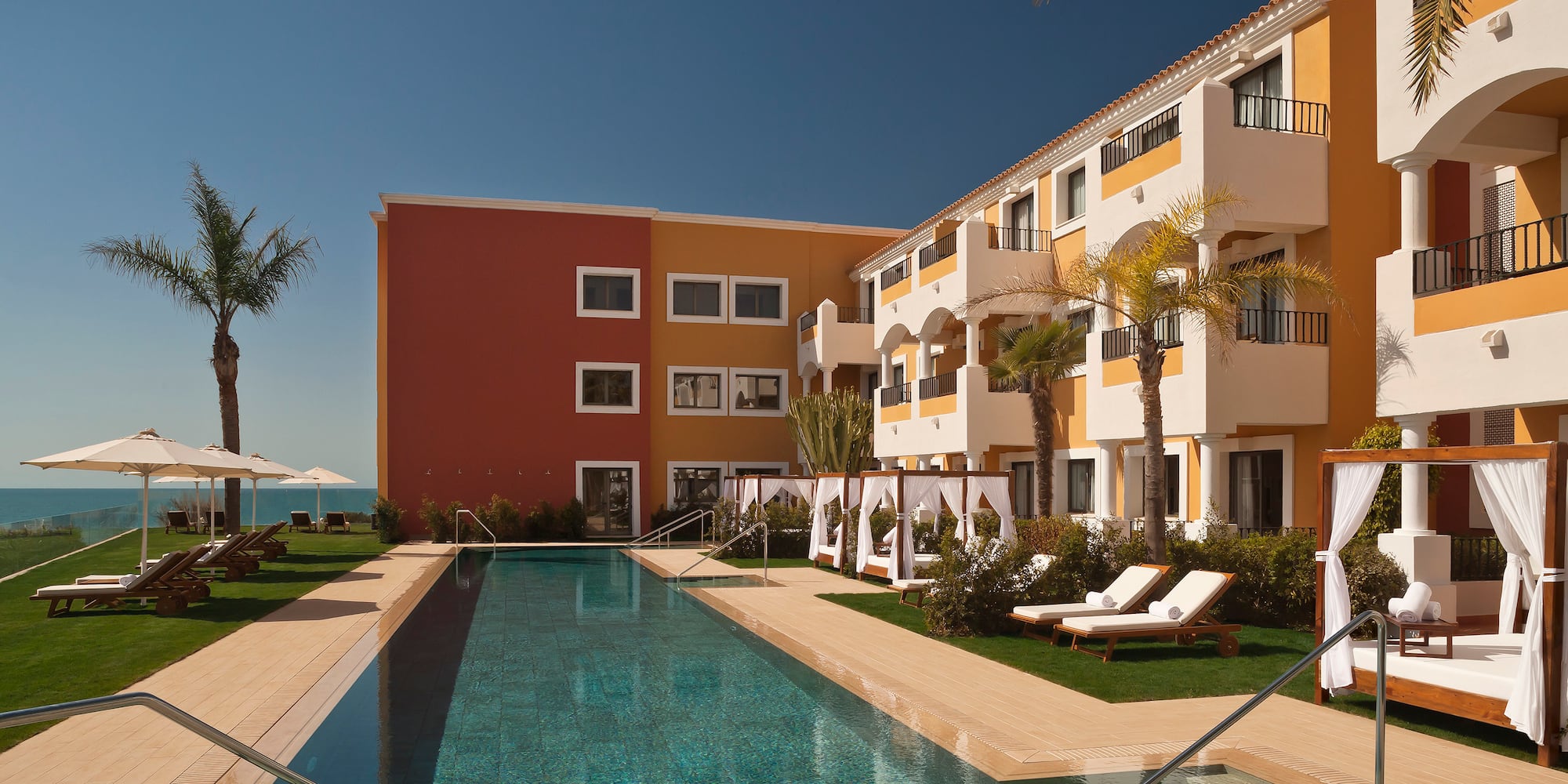 a swimming pool in front of a building