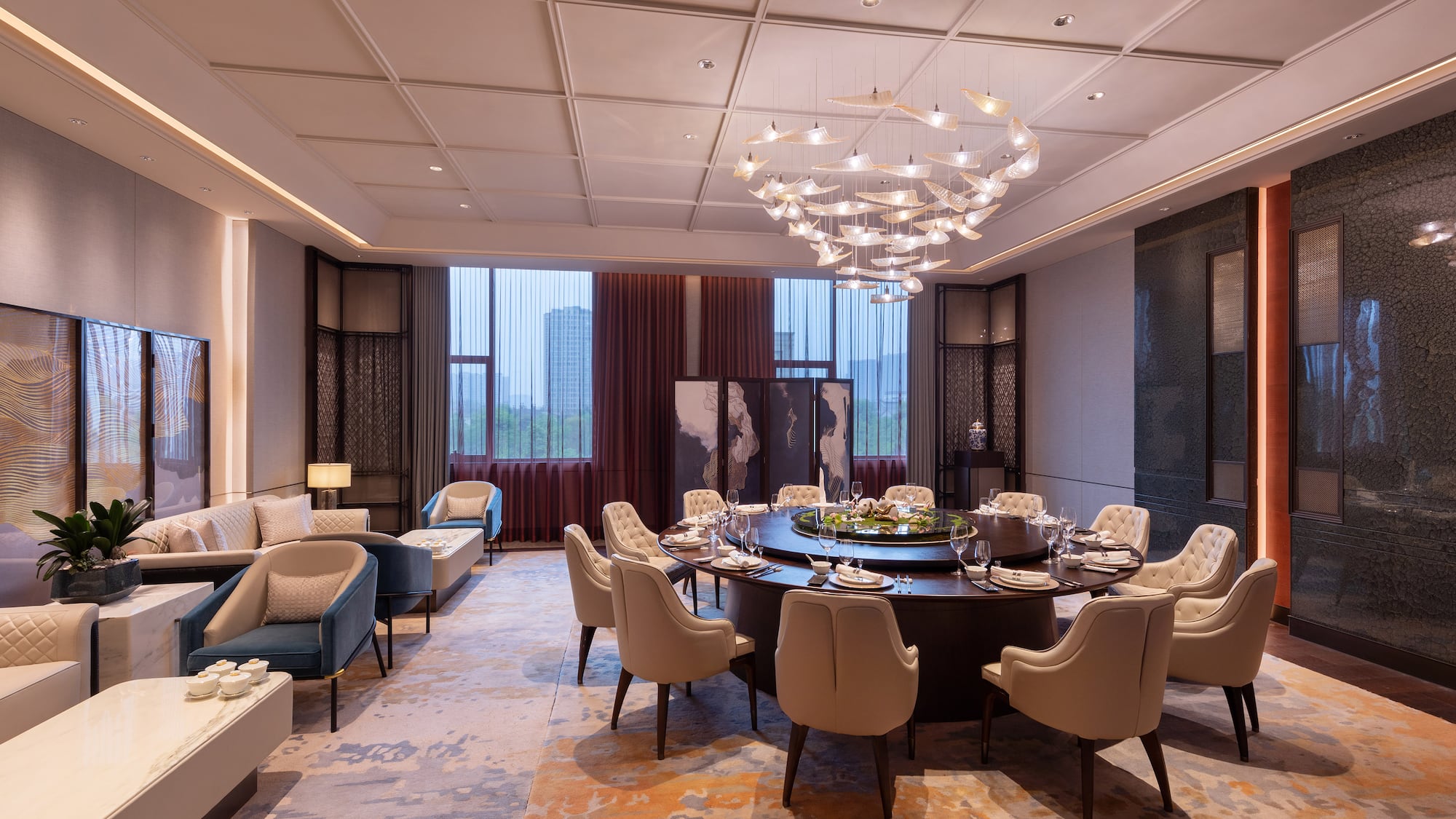 a room with a round table and chairs