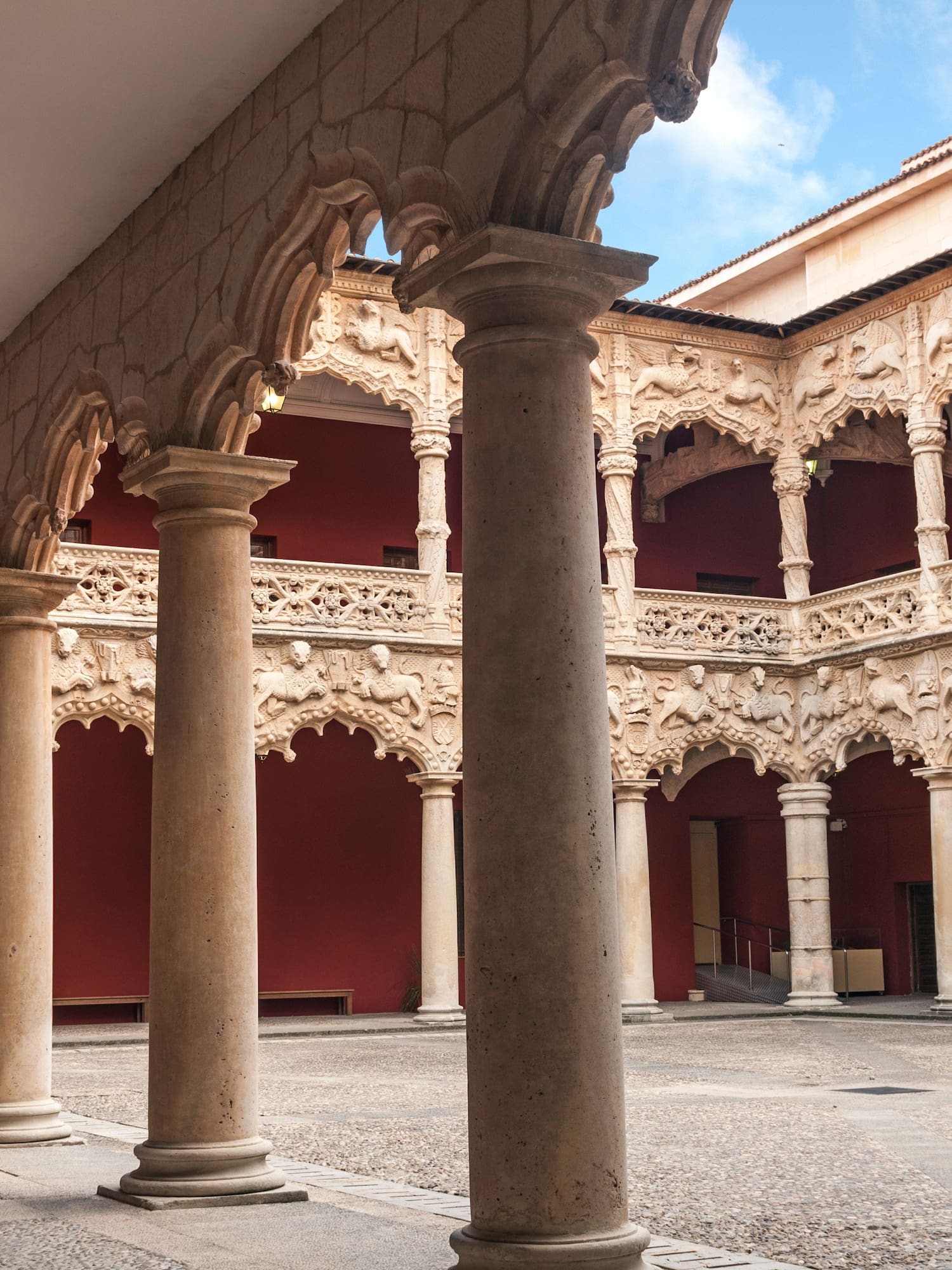 a courtyard with columns and arches