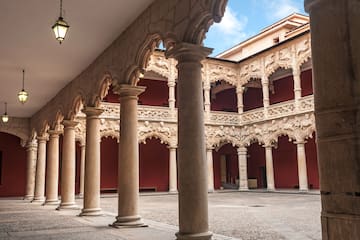 a courtyard with columns and arches