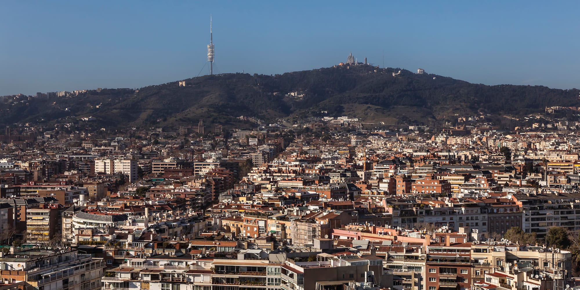 a city with a hill in the background