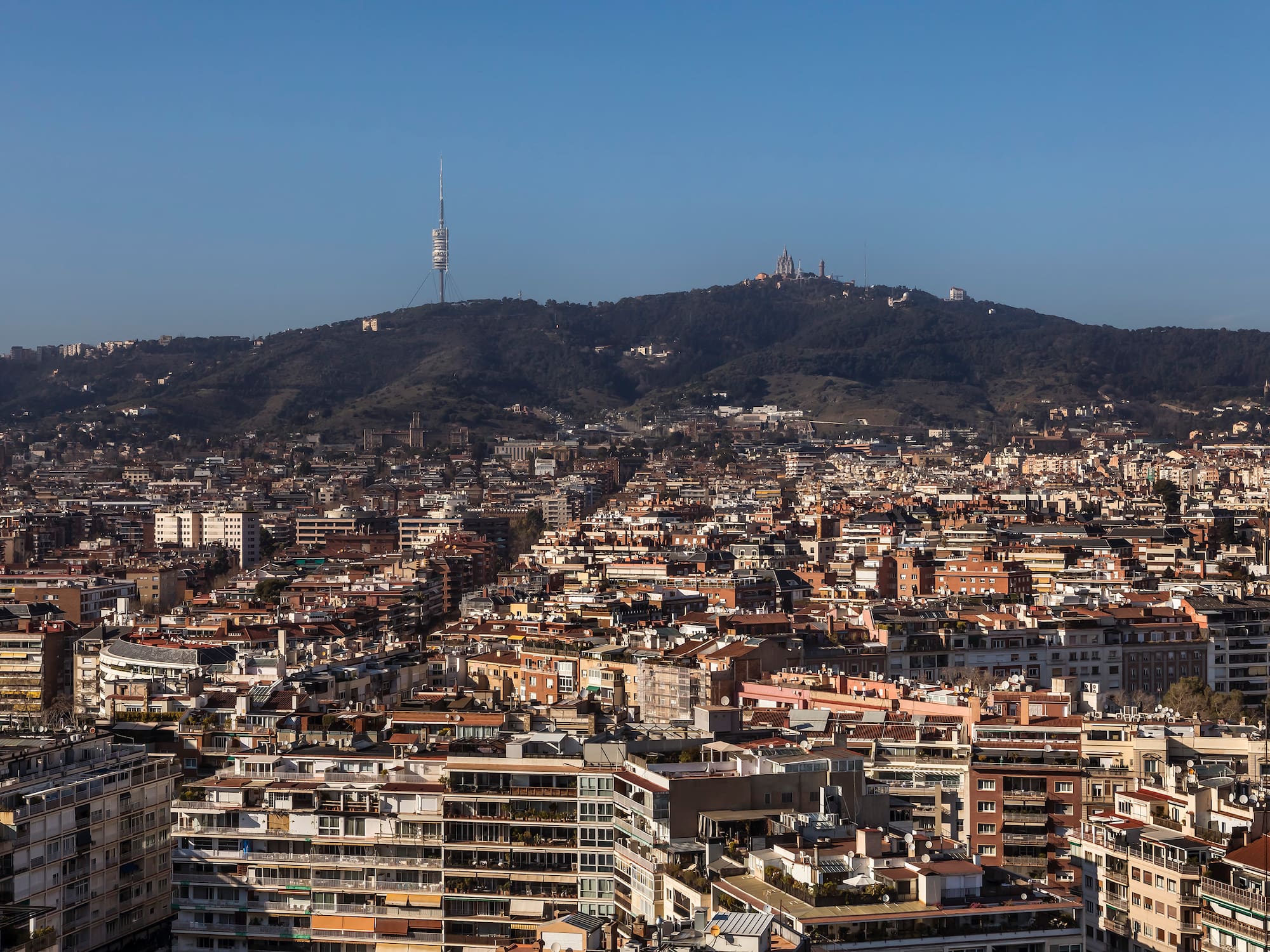a city with a hill in the background