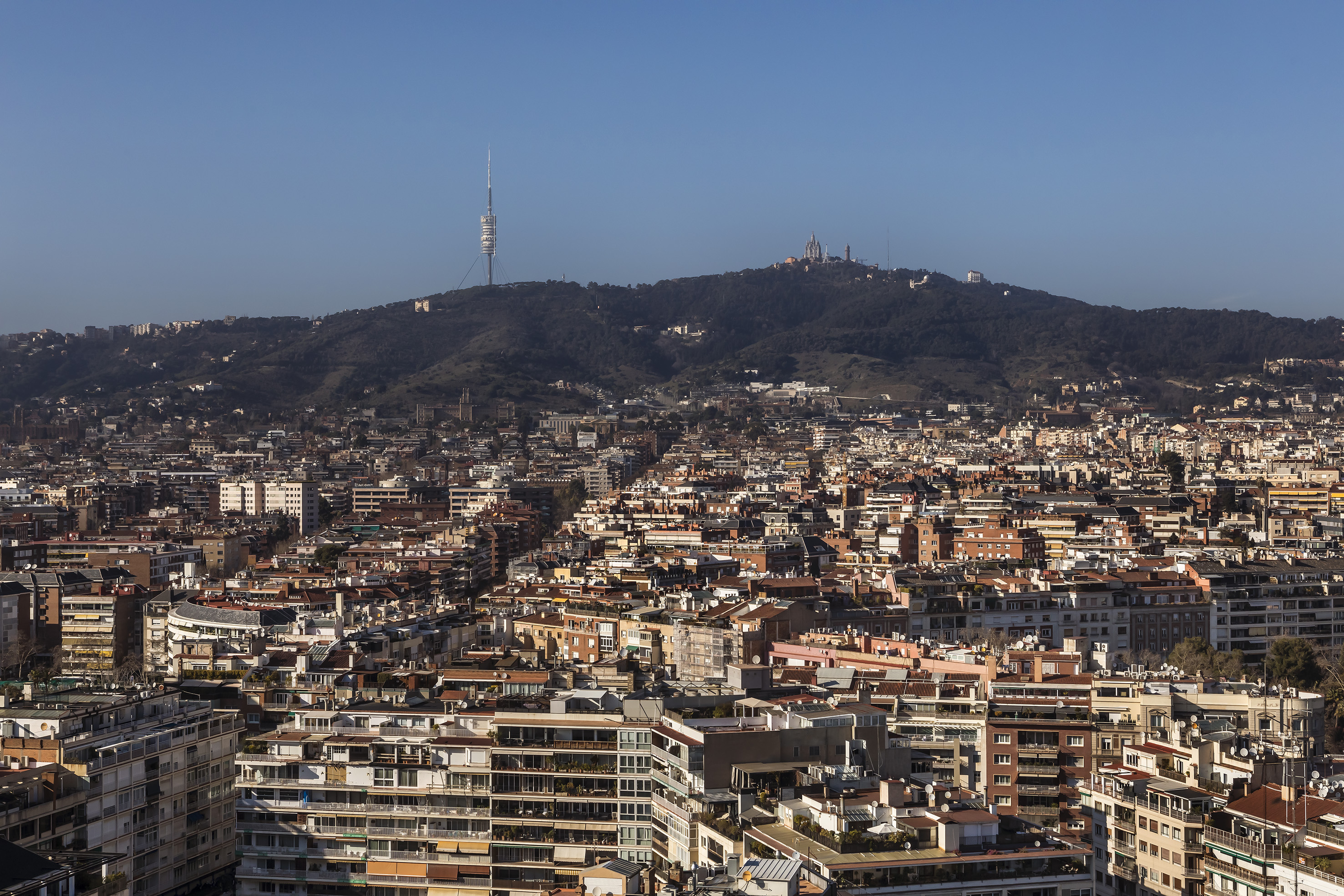 a city with a hill in the background