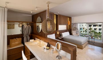 a room with a bed and a mirror