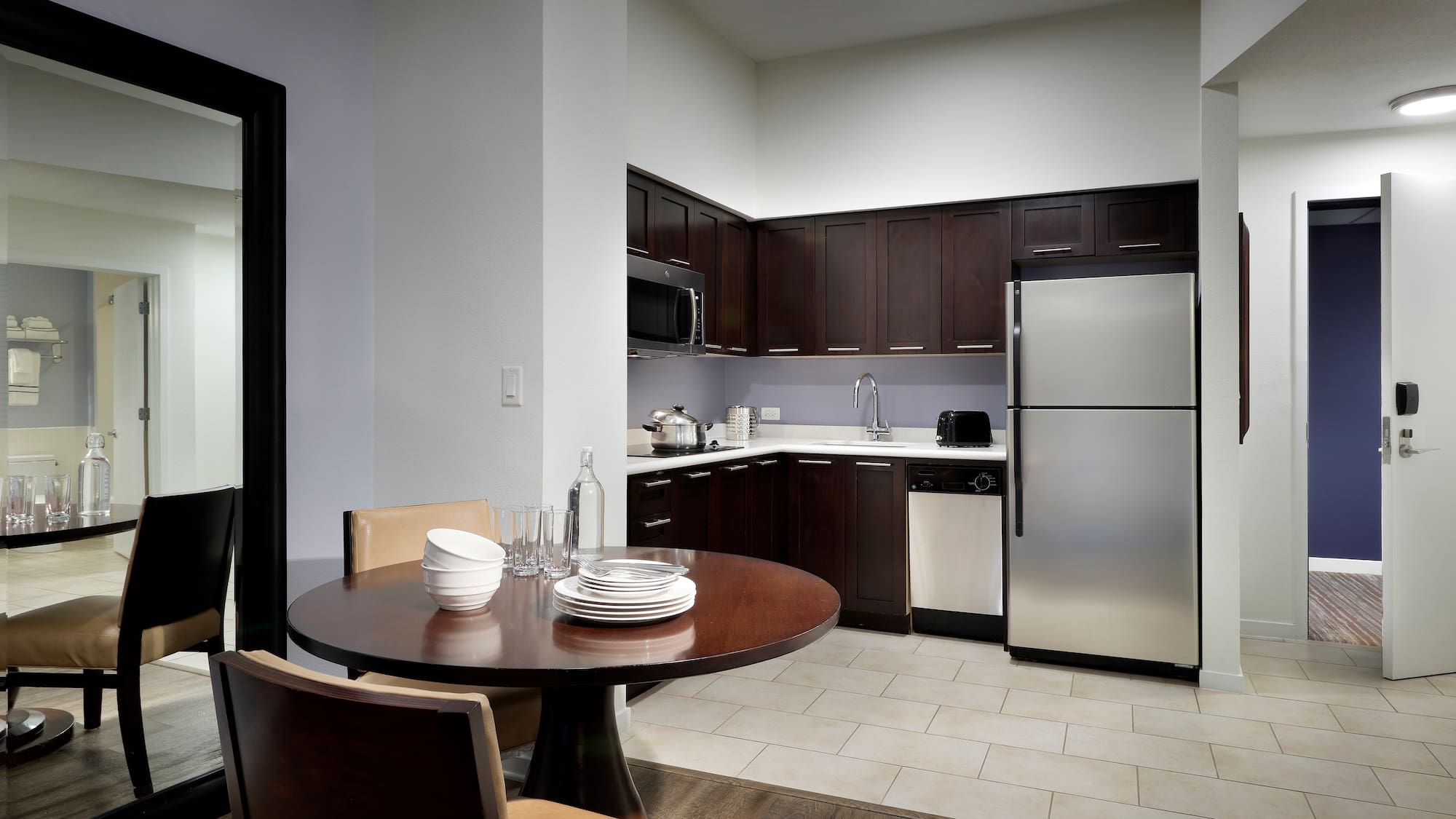 a kitchen with a table and chairs