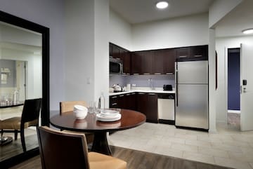 a kitchen with a table and chairs