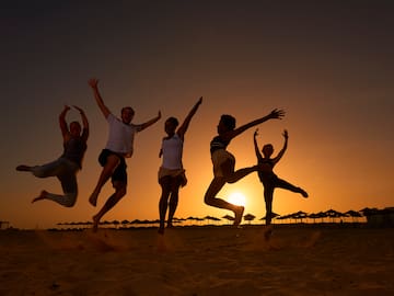 a group of people jumping in the air