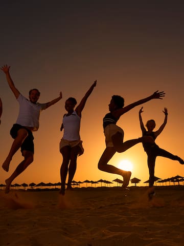 a group of people jumping in the air