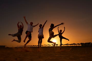 a group of people jumping in the air