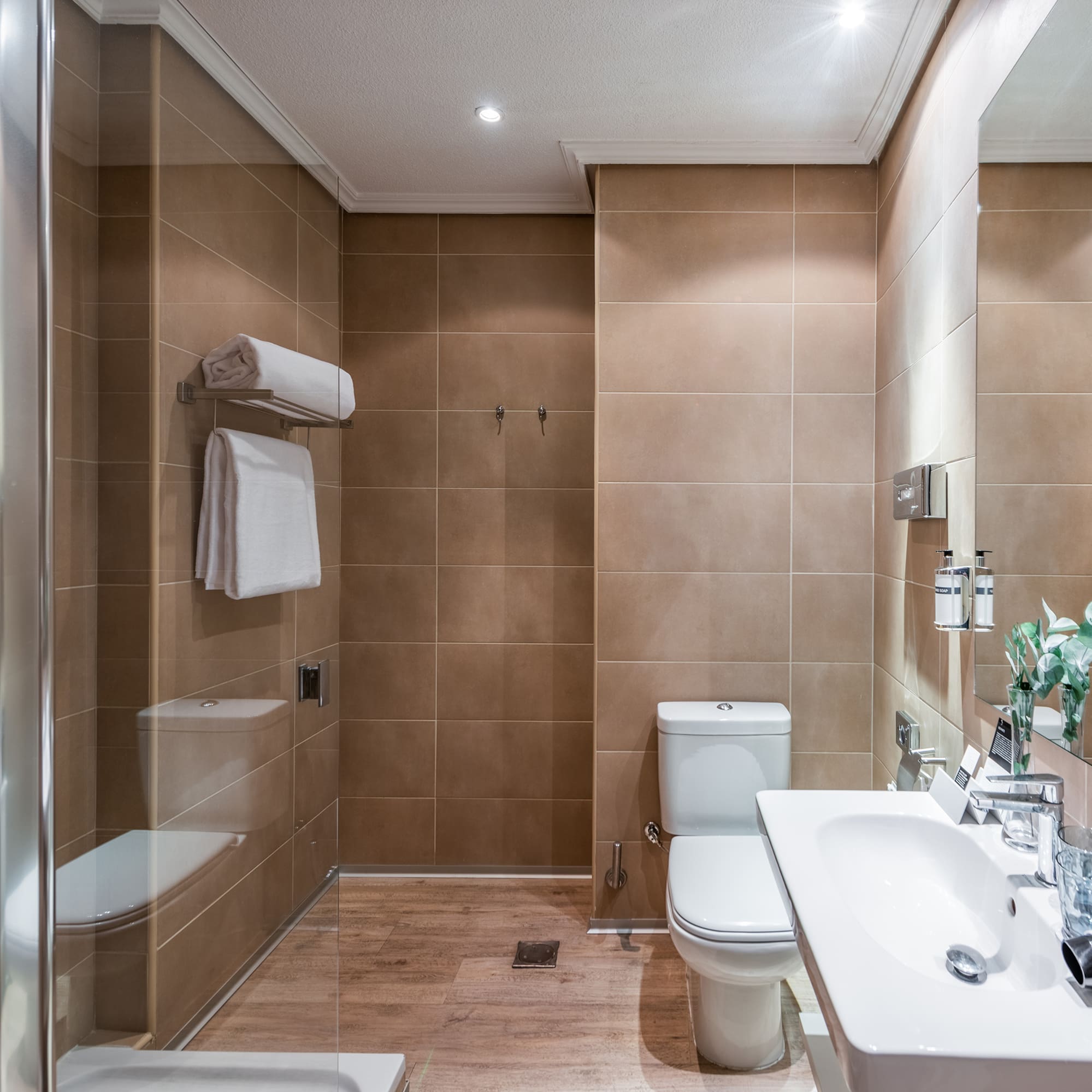 a bathroom with a shower and toilet