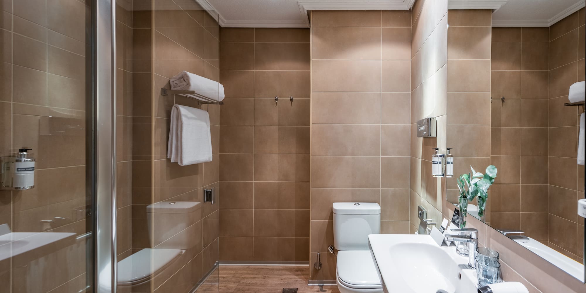 a bathroom with a shower and toilet