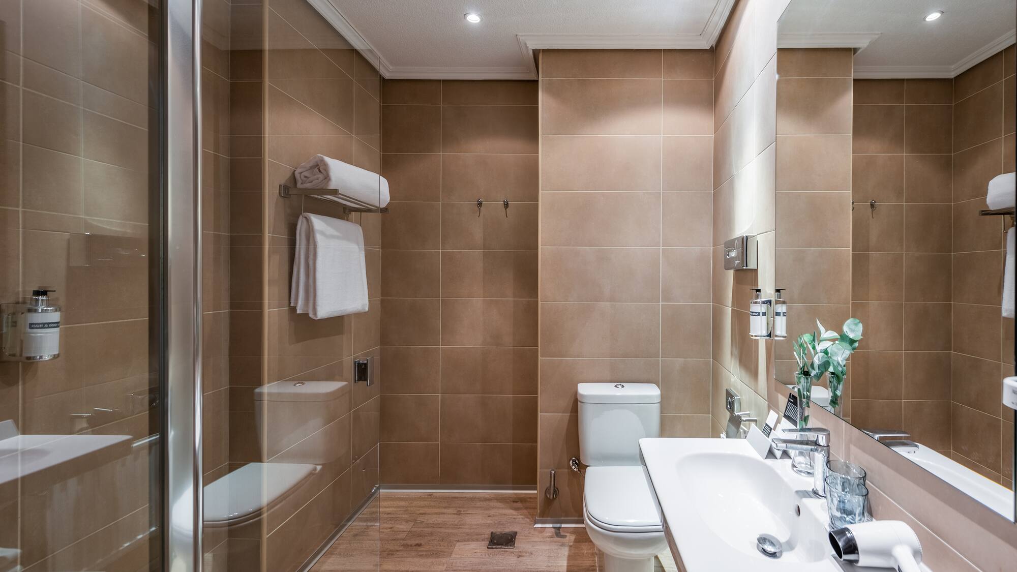 a bathroom with a shower and toilet