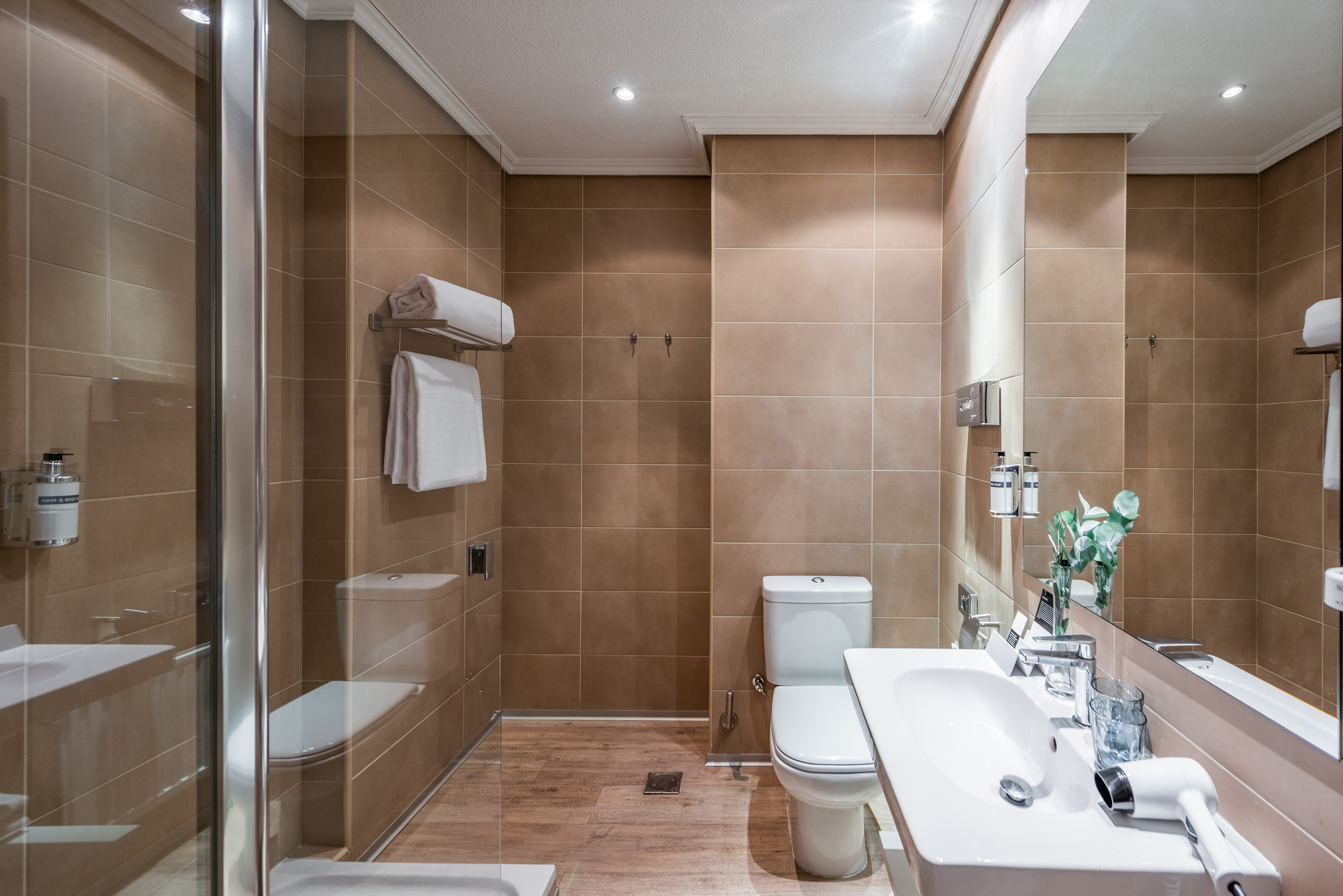 a bathroom with a shower and toilet