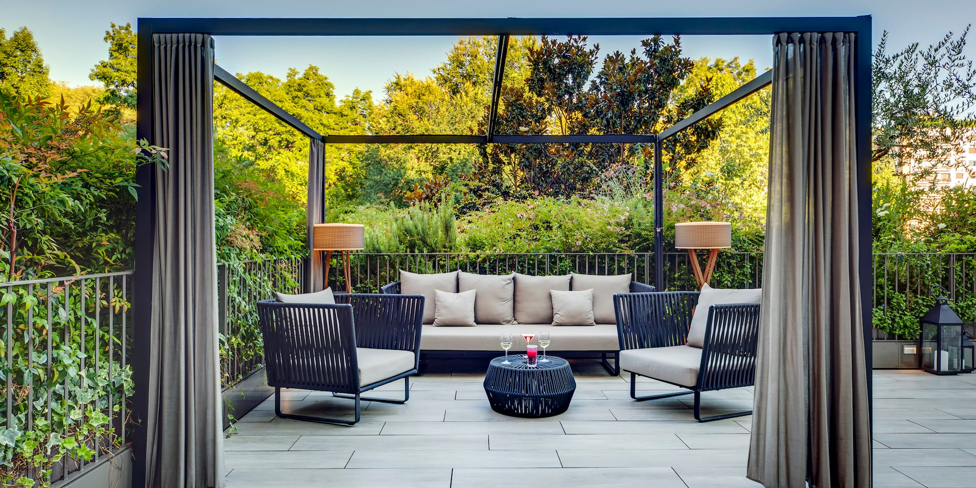 a patio with a couch and chairs