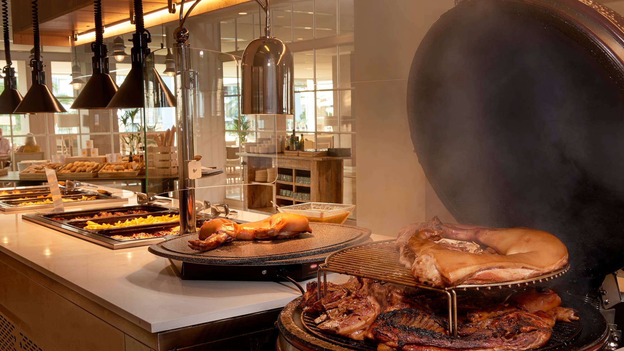 a large group of meat on a grill